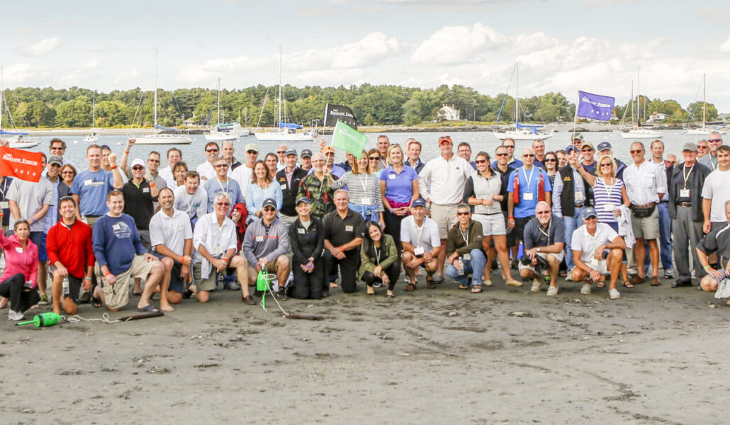 group-photo-of-the-bigelow-forum-attendees-on-beach